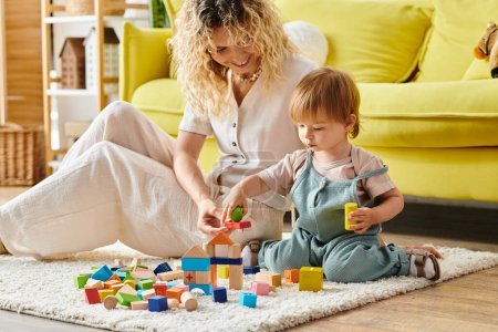 A curly-haired mother engages in playful Montessori activities with her toddler daughter on the floor at home.