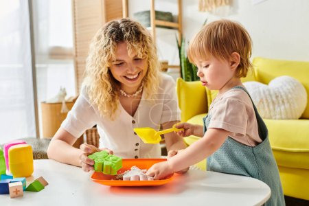 A curly mother and her toddler daughter enjoy a Montessori-style activity with a bowl, fostering learning and connection.