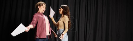 Photo for A woman and man rehearsing on a theater stage. - Royalty Free Image