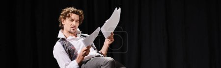 Photo for Handsome man in white shirt and tie, holding papers. - Royalty Free Image