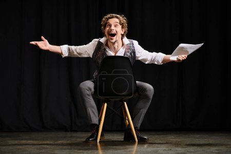 Man on chair, arms outstretched