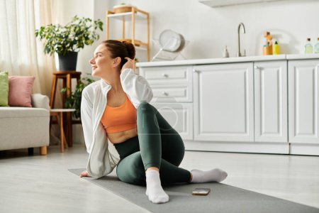Middle-aged woman peacefully practices yoga on a mat in a cozy living room setting.