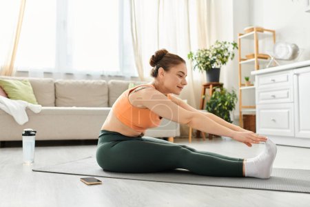 Middle-aged woman gracefully performing a yoga pose in a cozy living room.