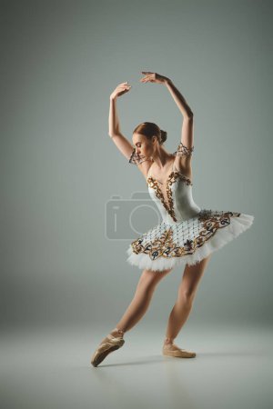 Talented ballerina strikes a pose in white tutu.