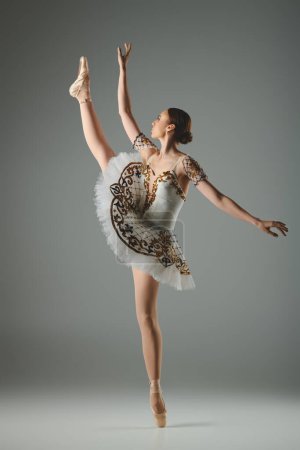 Young, talented ballerina dances gracefully in white tutu and leotard.