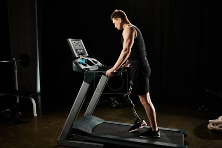 A man with a prosthetic leg exercises on a treadmill in the dimly lit gym.