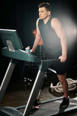A disabled man with a prosthetic leg is vigorously running on a treadmill in a gym setting.