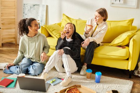 A diverse group of teenage girls relax and bond on a bright yellow couch in a cozy setting.