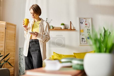 A serene moment as a teenage girl stands in her cozy living room, enjoying a cup of coffee during her e-learning session.