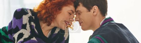 joyous beautiful woman with closed eyes enjoying her cheerful boyfriend company at home, banner