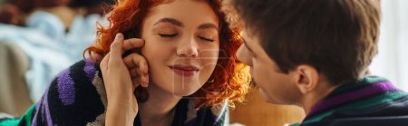 attractive red haired woman with closed eyes enjoying her loving boyfriend company, banner