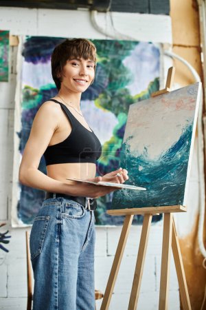 Woman creates masterpiece at easel.