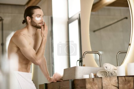 Photo for Man with skincare products in front of mirror. - Royalty Free Image