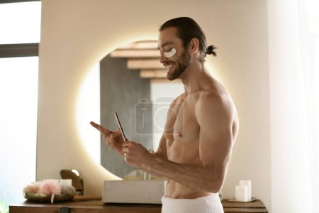 A handsome man in a towel with nail file.