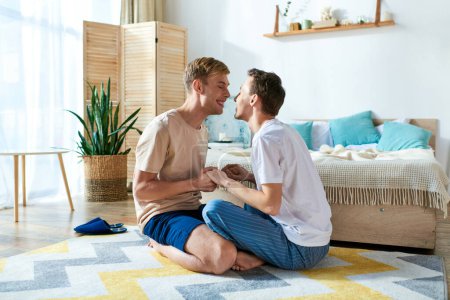 Loving gay couple in casual attire, sitting closely on vibrant rug, sharing a tranquil moment together.