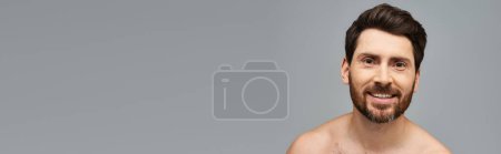 Photo for A man without a shirt striking a confident pose. - Royalty Free Image