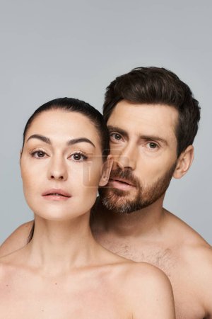 Photo for A man and woman elegantly pose together in a photoshoot. - Royalty Free Image
