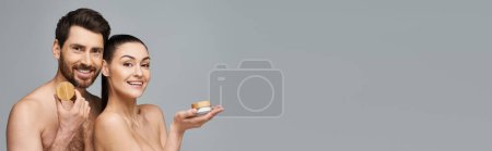 Photo for A loving couple poses together in a skincare promotion. - Royalty Free Image