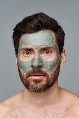 Photo for A man wearing a facial mask, skincare. - Royalty Free Image