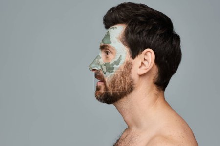 Photo for A man wearing a face mask and looking away. - Royalty Free Image
