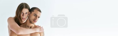 Photo for A man tenderly holding his boyfirend in his arms. - Royalty Free Image