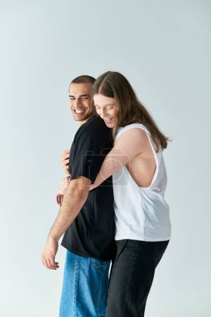 Photo for A loving gay couple, two men, embrace each other in a warm, supportive hug. - Royalty Free Image
