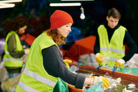 A young woman in a green vest and a man in a black shirt, wearing gloves, sorting trash as eco-conscious volunteers.