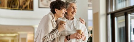 Photo for Senior lesbian couple stand together, showing love and tenderness. - Royalty Free Image