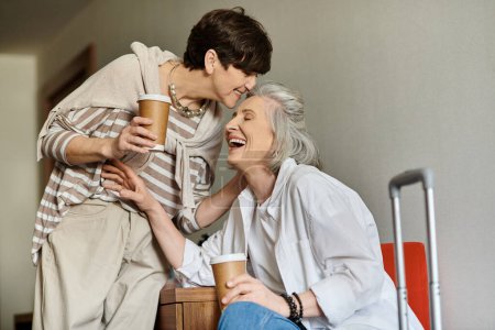 Photo for A senior lesbian couple sitting together in a tender moment. - Royalty Free Image
