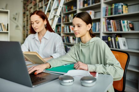A redhead tutor teaches a teenage girl in a library, working on a laptop together for modern education.