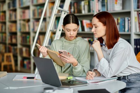 Tutor teaches teenager in a library using a laptop for modern education, engaging in interactive lessons and discussions.