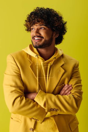 Photo for Handsome young man in yellow suit with arms crossed. - Royalty Free Image