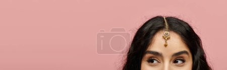 Photo for Young indian woman with long hair adorned with a tiara, exuding confidence and beauty. - Royalty Free Image