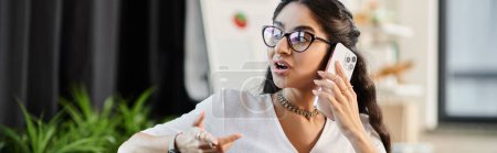 Photo for A fashionable female in glasses speaks on the phone. - Royalty Free Image