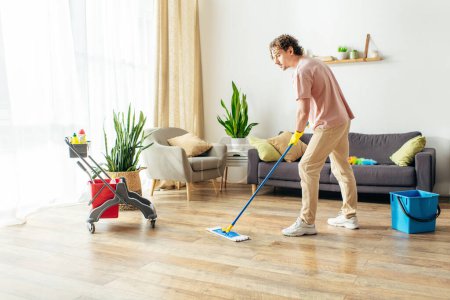 Man in action, mopping living room floor with a mop.