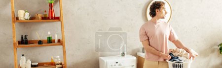 Téléchargez les photos : A man standing in a room, holding a laundry box. - en image libre de droit
