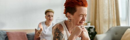 Photo for A woman with vibrant red hair is crying on couch, banner - Royalty Free Image