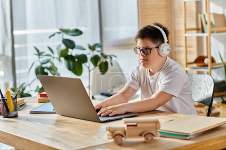 Photo for Child with Down syndrome with headphones, laptop, home setting. - Royalty Free Image