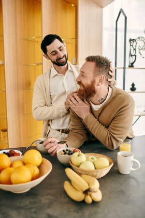 Two gay men, happy and relaxed, laugh together in a modern kitchen.
