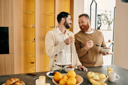 Two happy men, a gay couple, are sitting in a modern kitchen, enjoying breakfast together.