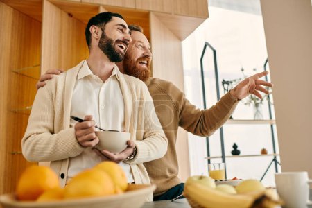 Two joyful men arranging a bowl of fresh fruit in a modern kitchen, sharing a loving moment together.