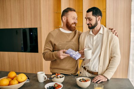 Photo for A happy gay couple stands in a modern kitchen, sipping coffee together. - Royalty Free Image