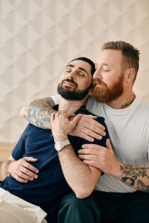Foto de Two cheerful men dressed casually share a warm hug on a cozy bed in a modern setting. - Imagen libre de derechos