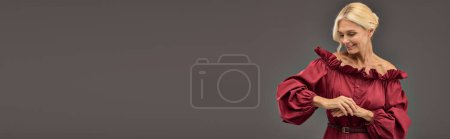 Photo for Elegant woman in red dress posing actively. - Royalty Free Image