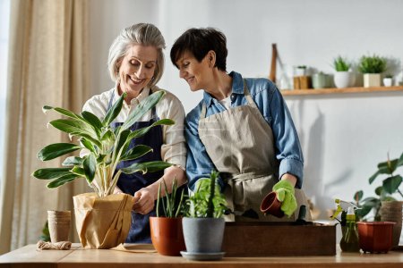 Two women in aprons caring for a potted plant with love and expertise.
