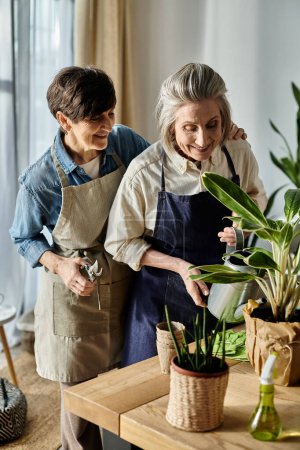 Two elegant elderly women caring for a potted plant.