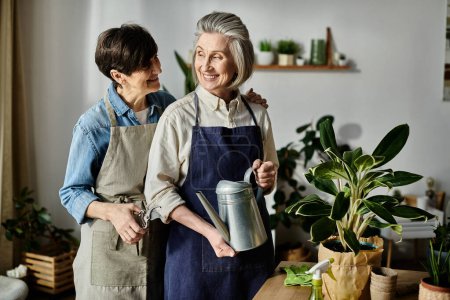 Two apron-clad women care for a potted plant in perfect harmony.