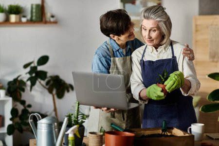 Photo for Two women engaging with a laptop together. - Royalty Free Image