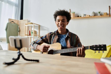 Young man playing acoustic guitar in cozy living room.