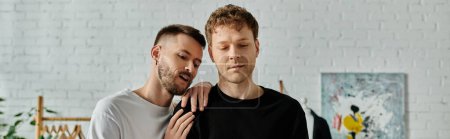 A gay couple, working together in a designer workshop, creating trendy attire.